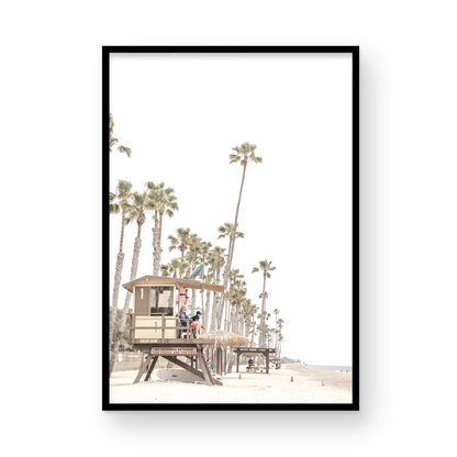 A landscape coastal photography view of San Clemente State Beach in Southern California, featuring a row of tall palm trees, a lifeguard tower, and people enjoying the calm beach. This vertical image evokes Summer Vibes Wall Art and tropical beach print aesthetics. Photograph in minimalist mock up.