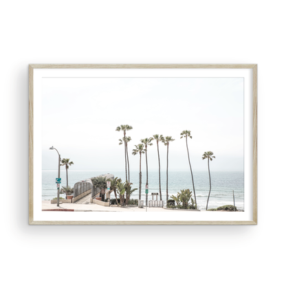  Landscape coastal photography of T-Street Beach in San Clemente, with tall palm trees and a unique pier structure leading to the ocean. A perfect horizontal California coast print. Photograph in minimalist mock up