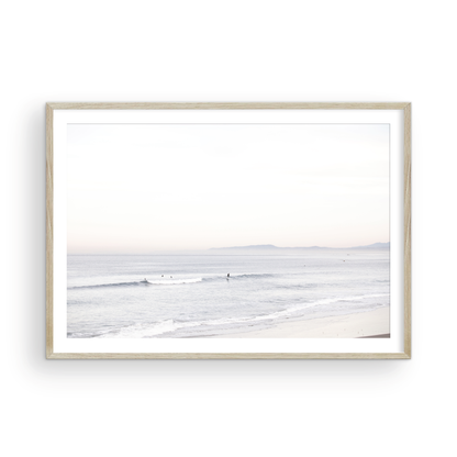 Horizontal minimalist ocean print showing a smooth seascape with gentle ocean waves meeting a clear horizon line. This calm ocean print provides a serene view. Photograph in minimalist mock up.
