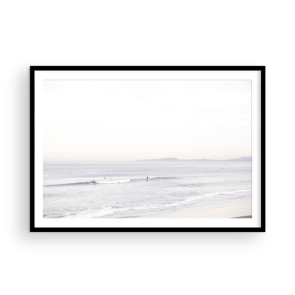 Horizontal minimalist ocean print showing a smooth seascape with gentle ocean waves meeting a clear horizon line. This calm ocean print provides a serene view. Photograph in minimalist mock up.