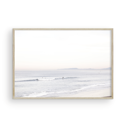 Horizontal minimalist ocean print showing a smooth seascape with gentle ocean waves meeting a clear horizon line. This calm ocean print provides a serene view. Photograph in minimalist mock up.