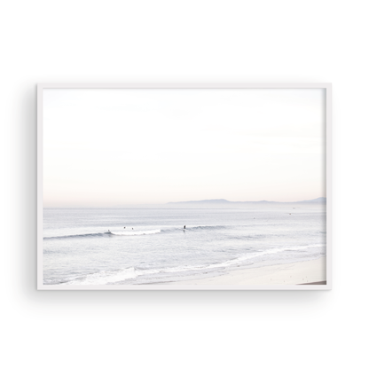 Horizontal minimalist ocean print showing a smooth seascape with gentle ocean waves meeting a clear horizon line. This calm ocean print provides a serene view. Photograph in minimalist mock up.