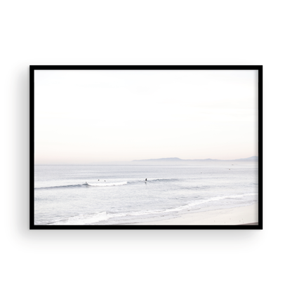Horizontal minimalist ocean print showing a smooth seascape with gentle ocean waves meeting a clear horizon line. This calm ocean print provides a serene view. Photograph in minimalist mock up.