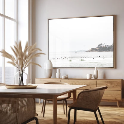 Landscape surf wall decor showing many surfers waiting for waves in the ocean at Salt Creek Beach, with a distant cliffside. This print captures the surf vibes of Southern California. Photograph in minimalist mock up.