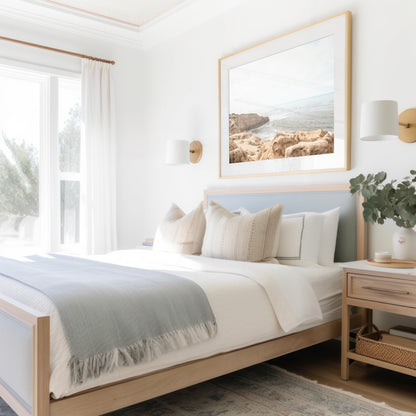 Fine art of Sunset Cliffs, San Diego California horizontal print of hazy high-angle landscape beach photography captures a light blue ocean meeting tall tan and brown cliffs rise as iconic coastal scenery. Photograph in minimalist art mock up.