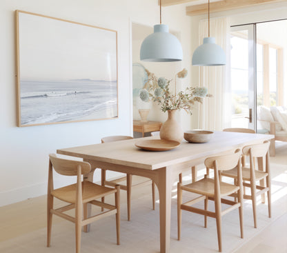 Horizontal minimalist ocean print showing a smooth seascape with gentle ocean waves meeting a clear horizon line. This calm ocean print provides a serene view. Photograph in minimalist mock up.