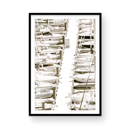 Vertical nautical wall print featuring a marina packed with white boats docked at the San Diego harbor. Photograph in minimalist mock up.