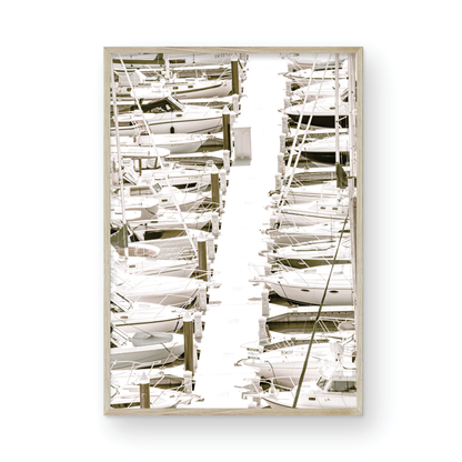 Vertical nautical wall print featuring a marina packed with white boats docked at the San Diego harbor. Photograph in minimalist mock up.