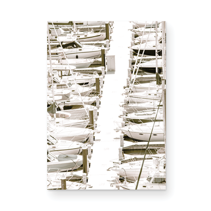 Vertical nautical wall print featuring a marina packed with white boats docked at the San Diego harbor. Photograph in minimalist mock up.