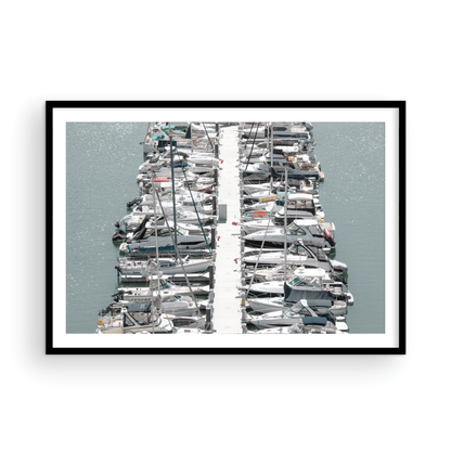 Horizontal nautical wall print featuring a marina packed with white boats docked at the San Diego harbor. Photograph in minimalist mock up.