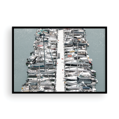 Horizontal nautical wall print featuring a marina packed with white boats docked at the San Diego harbor. Photograph in minimalist mock up.