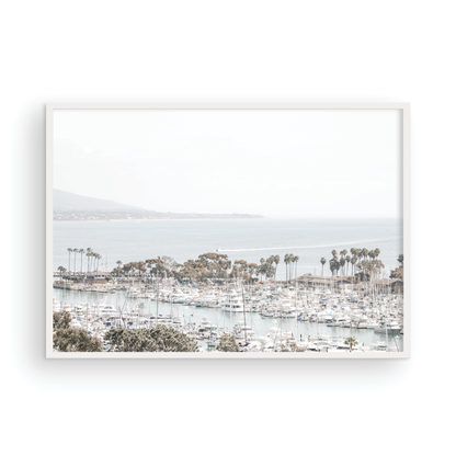Horizontal nautical wall print featuring a marina with boats and palm trees on a foggy day, white boats docked at the San Diego harbor. Photograph in minimalist mock up.
