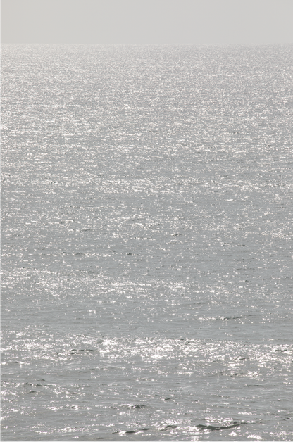 Minimalist ocean art print of a bright, sunlit ocean surface, creating a sparkling vertical seascape.