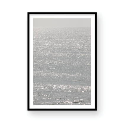 Minimalist ocean art print of a bright, sunlit ocean surface, creating a sparkling vertical seascape. Photograph in minimalist mock up.