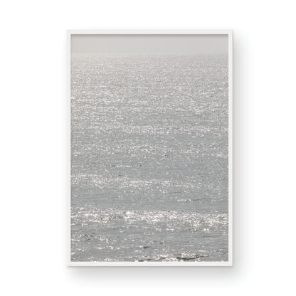 Minimalist ocean art print of a bright, sunlit ocean surface, creating a sparkling vertical seascape. Photograph in minimalist mock up.