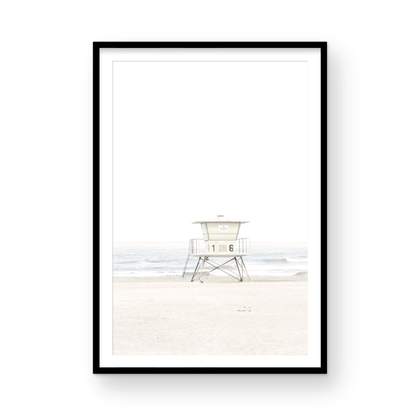 A vertical beach art close-up of a pale lifeguard tower (16), with ocean waves in the distance, on a San Diego Beach. Photograph in minimalist mock up.