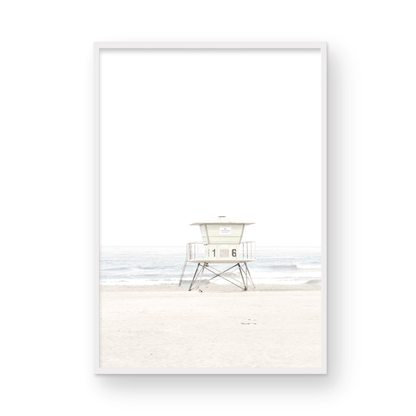 A vertical beach art close-up of a pale lifeguard tower (16), with ocean waves in the distance, on a San Diego Beach. Photograph in minimalist mock up.