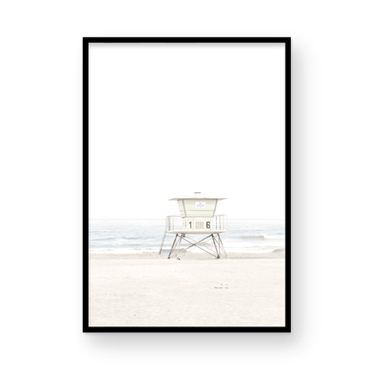 A vertical beach art close-up of a pale lifeguard tower (16), with ocean waves in the distance, on a San Diego Beach. Photograph in minimalist mock up.
