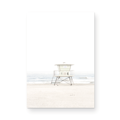 A vertical beach art close-up of a pale lifeguard tower (16), with ocean waves in the distance, on a San Diego Beach. Photograph in minimalist mock up.