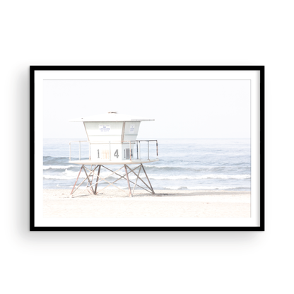 A horizontal beach art close-up of a pale lifeguard tower (14), with ocean waves in the distance, on a San Diego Beach. Photograph in minimalist mock up.