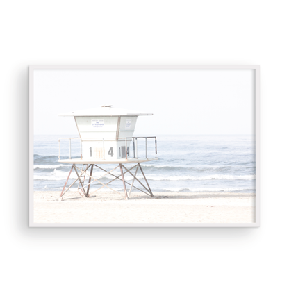 A horizontal beach art close-up of a pale lifeguard tower (14), with ocean waves in the distance, on a San Diego Beach. Photograph in minimalist mock up.