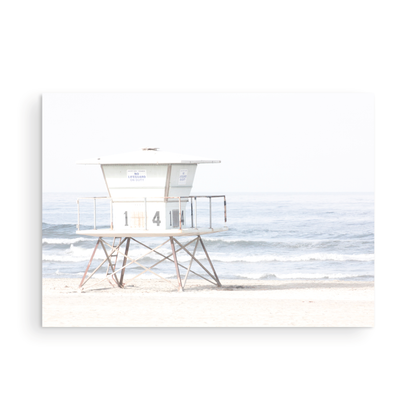 A horizontal beach art close-up of a pale lifeguard tower (14), with ocean waves in the distance, on a San Diego Beach. Photograph in minimalist mock up.