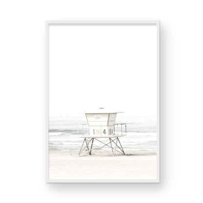 A vertical beach art close-up of a pale lifeguard tower (14), with ocean waves in the distance, on a San Diego Beach. Photograph in minimalist mock up.