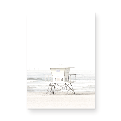 A vertical beach art close-up of a pale lifeguard tower (14), with ocean waves in the distance, on a San Diego Beach. Photograph in minimalist mock up.