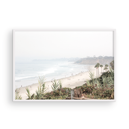 Landscape San Diego beach print showing seascape with gentle ocean waves in the water near a sandy cliff. Photograph in minimalist mock up.