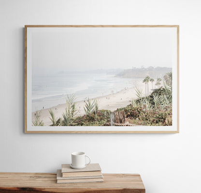 Landscape San Diego beach print showing seascape with gentle ocean waves in the water near a sandy cliff. Photograph in minimalist mock up.