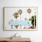 Colorful travel photography capturing the iconic 'Solana Beach' sign, a quintessential piece of Surf Signs San Diego art. The retro light blue sign, adorned with white cursive script and a unique steer head logo, is set against a backdrop of towering palm trees and a bright, hazy California sky. This Southern California surf beach sign evokes strong summer vibes and is perfect for coastal decor. Photograph in minimalist framed mock up.