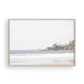 Landscape surf wall decor featuring surfers in the ocean near Salt Creek Beach, with a distant residential coastline and crashing waves. This print captures the surf vibes. Photograph in minimalist mock up.