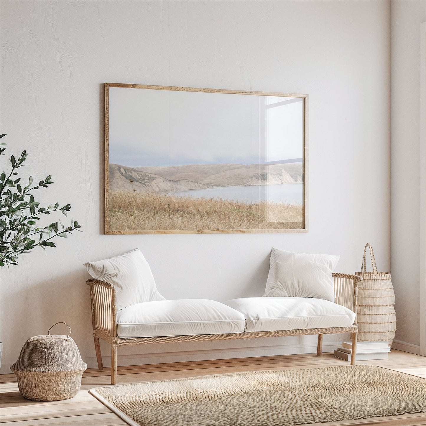 Framed photo of: Drakes Bay 7299 displayed above a couch in a neutral room.