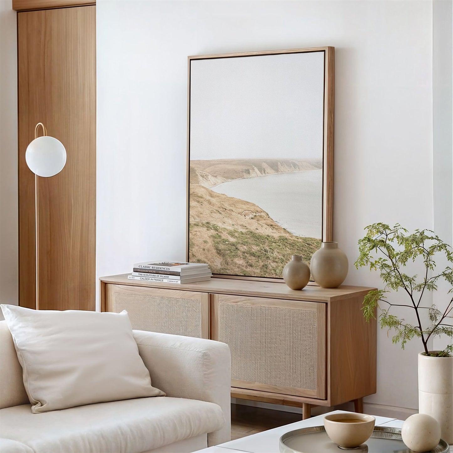 Framed canvas photo of: Drakes Bay 7273 displayed above a console in a neutral modern living room.