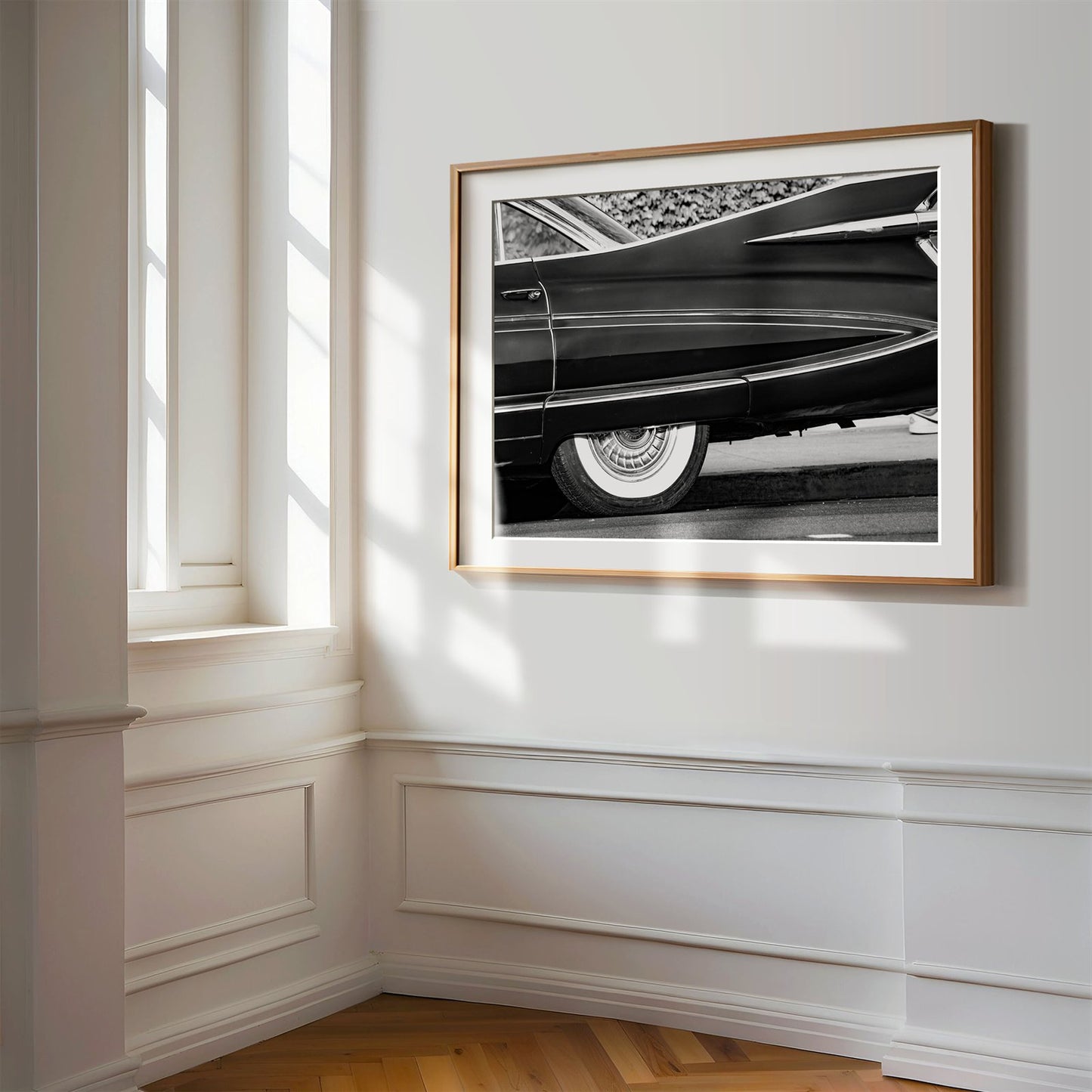 Framed photo of: Cadillac Fleetwood 7961 displayed on a wall in a luxury hallway.