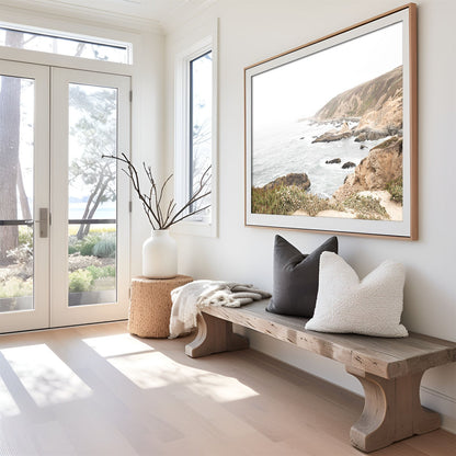 Framed photo of: Bodega Head 7728 displayed above a bench in an entry way.