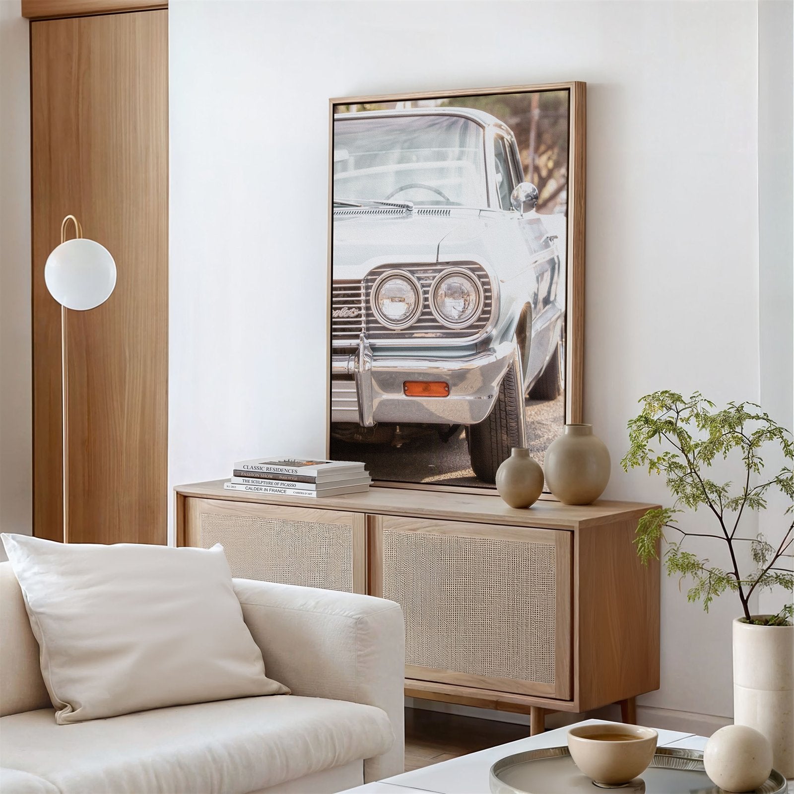 Framed canvas photo of: Chevrolet 7975 displayed on a wall above a console in a modern living room.