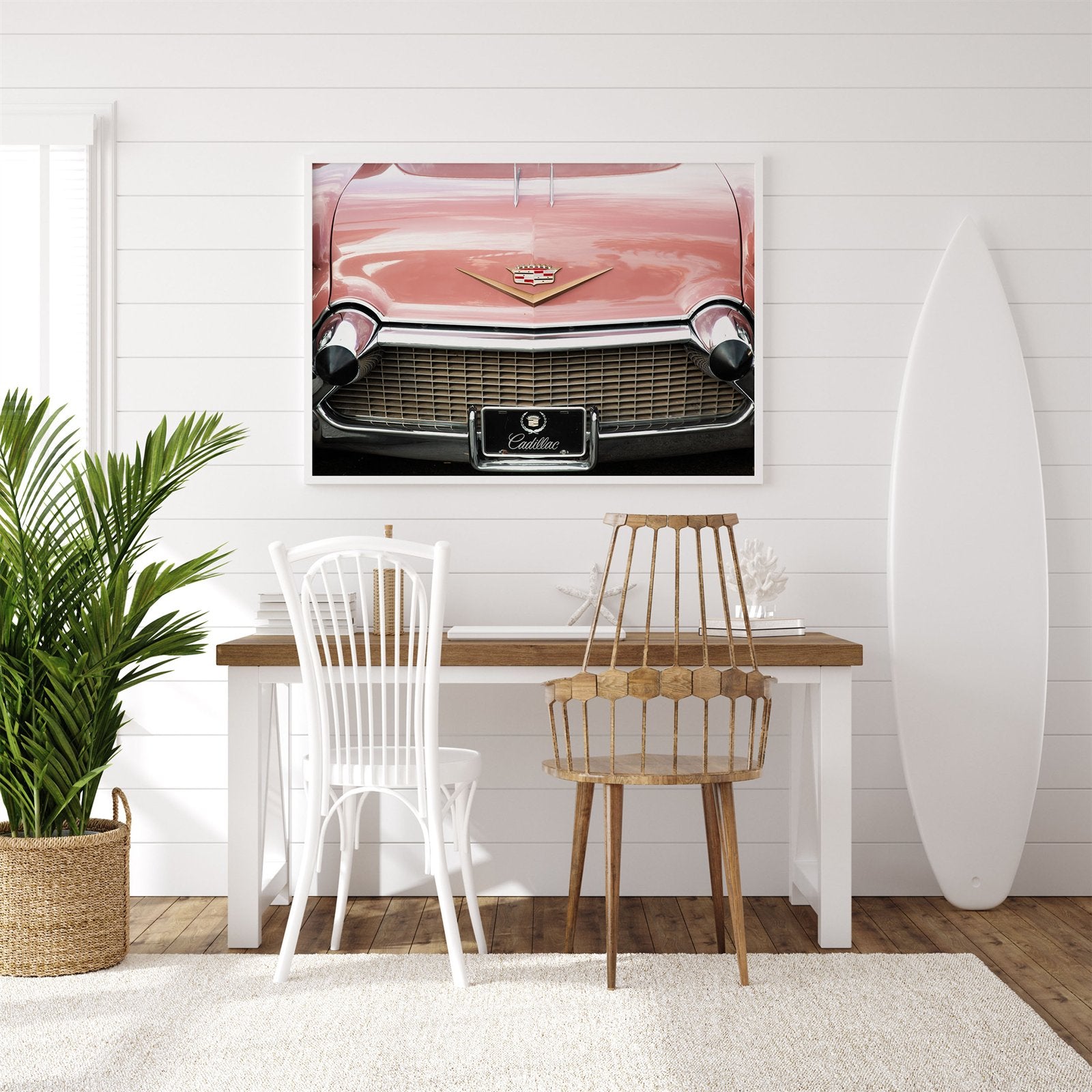 Framed photo of: Cadillac 7917 displayed above a desk in a surf theme room.