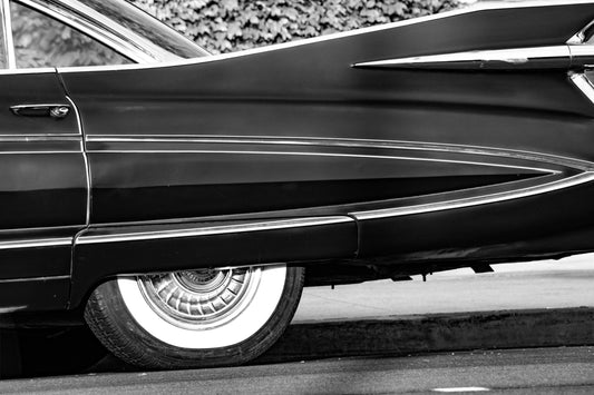 Photography by Salt Creek Prints of: Cadillac Fleetwood 7961, Close up image of the tail end of a vintage Cadillac Fleetwood in black and white.