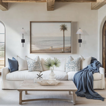Framed photo of: Moonlight Beach 9130 displayed above a couch in a coastal living room.