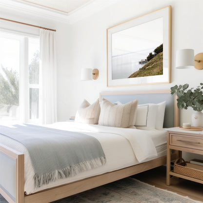 Framed photo of: Point Reyes 7376 displayed above a bed in a coastal bedroom.