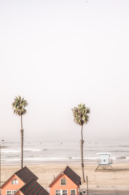 Photography by Kim Dybczak of: A lifeguard tower anchors California, set against calm water and open sky.