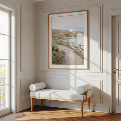 Framed photo of: Drakes Bay 7374 displayed above a bench in luxury hallway.