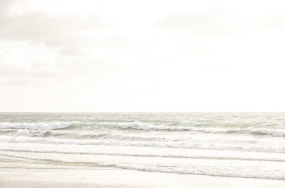 Photography by Kim Dybczak of: San Diego coast settles into long bands of sand and water beneath open sky.