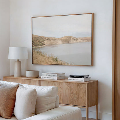 Framed canvas photo of: Drakes Bay 7384 displayed above a console in a modern living room.