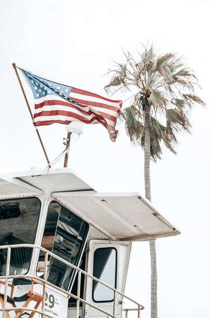 Photography by Kim Dybczak of: A simple lifeguard tower stands on the sand at California, with gentle waves behind it.