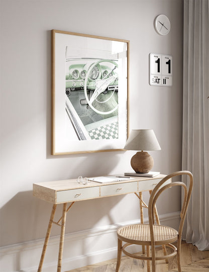 Framed photo of: Bel Air 7889 displayed above a desk.