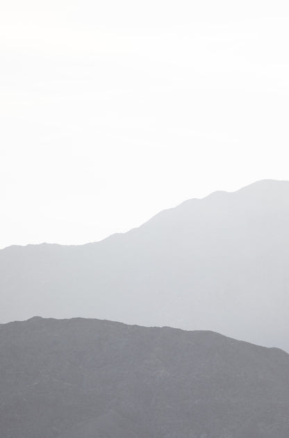 Photography by Kim Dybczak of: Hazy mountain layers fade into soft tones in Palm Springs, California.
