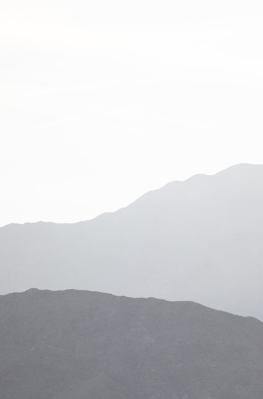 Photography by Kim Dybczak of: Hazy mountain layers fade into soft tones in Palm Springs, California.