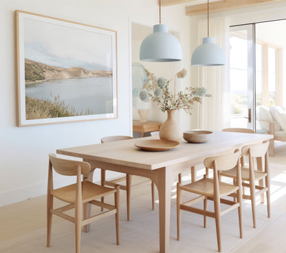 Framed photo of: Drakes Bay 7383 displayed on a wall in a coastal dining room.